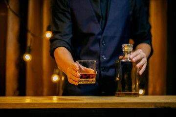 An elegant man suffering from alcoholism drinking whisky