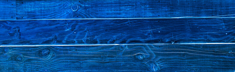 Inverted dark blue wooden background.