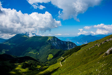 flower fields mountain peaks and clouds three