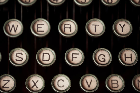 High angle of old fashioned typewriter with keys with letters and numbers
