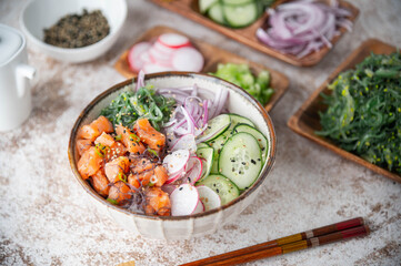 colorful salmon poke bowl with vegetables