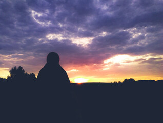 Fototapeta premium girl in a plaid at sunset