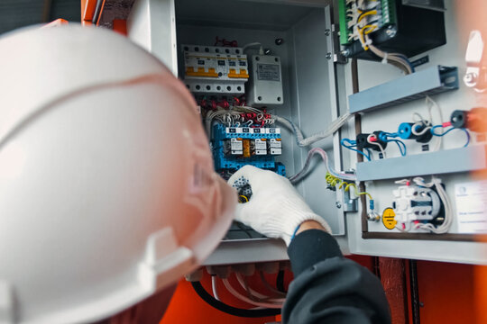 Repair work in the electric flap. electrician handles the equipm