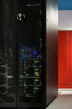 Interior of modern illuminated facility with metal server