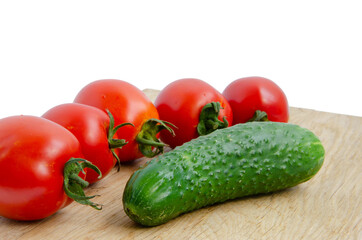 Fresh tomatoes and cucumber. Red and green vegetables. Cherry tomatoes vegetables white background