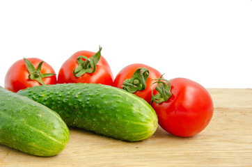 Fresh tomatoes and cucumber. Red and green vegetables. Cherry tomatoes vegetables white background