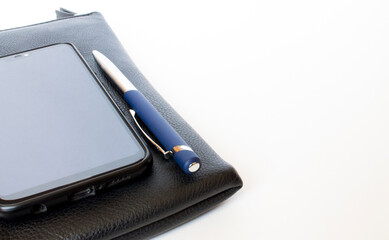 Black leather wallet with pen and mobile phone