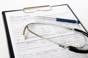 Prescription form lying on table with stethoscope and silver pen. Medicine or pharmacy concept.