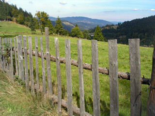 Fototapeta na wymiar An old wooden fence in the mountains, Beskid Śląski, Poland