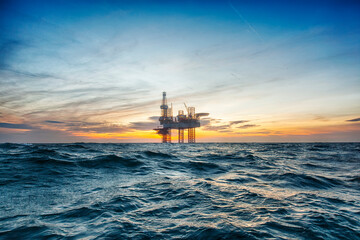 Offshore oil rig at sunset time