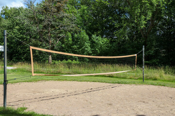 An empty volleyball court outside in the sunshine