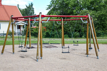 Empty swings in a childrens playground