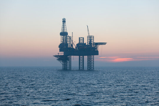 Offshore oil rig at sunset time