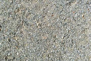 Decorative crushed gray pieces fine  gravel stones for construction industry. Stones background. Top view. Abstract texture. Background for design. Close-up.