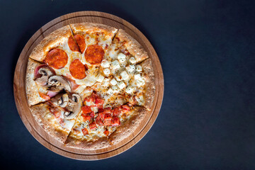 Pizza with vegetables on a dark background