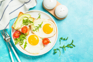 Healthy breakfast with egg, toast and salad.