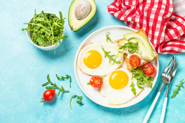 Healthy breakfast with egg, toast and salad.
