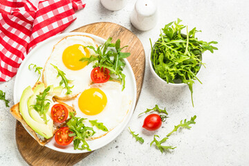 Healthy breakfast with egg, toast and salad.