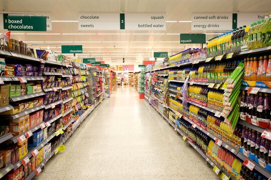 Aisles of stocked selves in a supermarket