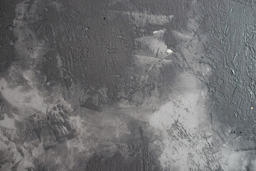 Background from plaster decorated with artificial concrete. Drying plaster on the wall.