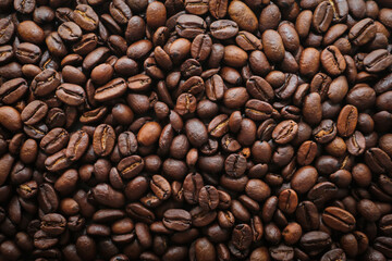 roasted coffee beans background macro closed up 