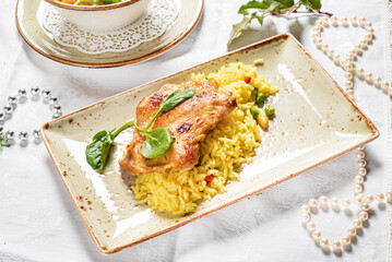 fried chicken with rice and vegetables