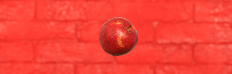 abstract red apple on red brick wall