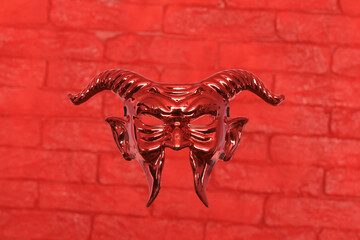red devil mask on red brick wall