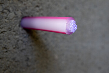 Optical fibre cable for communication in a hole drilled through concrete.