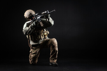 American special forces, a soldier in a military uniform with a weapon attacks on a black...