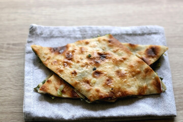 Thin dough filled with mangold, garlice and olive oil. Traditional food in Dalmatia, Croatia. Selective focus.