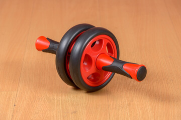 Portrait of ab wheel on wooden floor