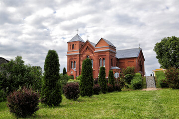 Fototapeta na wymiar Rositsa, Belarus - 06/13/2020: Catholic church of the Holy Trinity in the village of Rositsa, Belarus