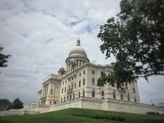 Downtown Providence Rhode Island RI USA State House Building (with dome) Neoclassical Design on Capital / Smith Hill, general assembly and office looking up on a grassy hill.  politicians 