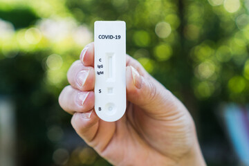 Person holding a quick test or diagnostic test of Covid-19 or sars-cov-2 that measures igg and igm to obtain the result by antibodies.
