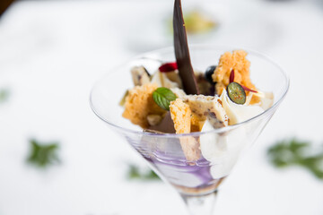 Dessert with biscuits, chocolate and ice cream. Modern cake in a glass