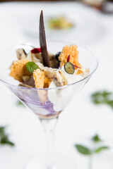 Dessert with biscuits, chocolate and ice cream. Modern cake in a glass