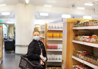 supermarket shopping, face mask and gloves,Woman choosing a dairy products at supermarket