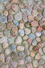 cobblestone pavement made of round stone around the ancient Peter and Paul Fortress in St. Petersburg, Russia