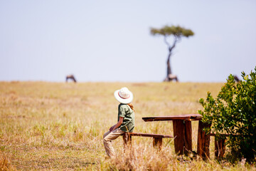 Little girl on safari in Africa © TravelPhotoBloggers
