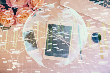 Double exposure of business theme hologram over desktop with phone. Top view. Mobile international trade connection concept.