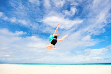 Happy girl on vacation jumping