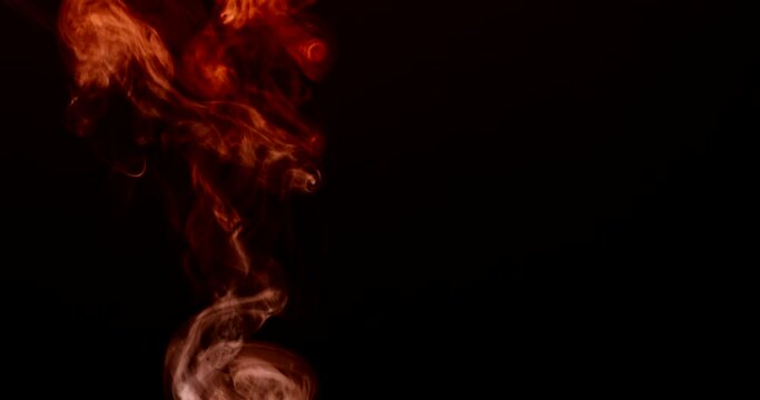 Abstract flames slowly rise up and expire. Isolated on black background. 4k DCI footage