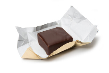 Chocolate candy open from a wrapper isolated on a white background