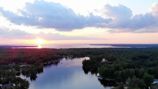 Drone footage of sunset Houghton Lake in Michigan, USA during summer