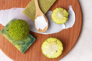 natural green soap from the fruit of osage apple or maclura, a plant with healing properties, top view