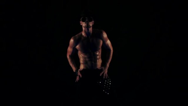 Silhouette of a dancing sexy man