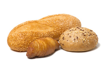 Loaf of bread with sesame seeds, croissant, oatmeal bun isolated on white background