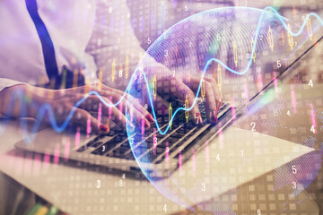 Multi exposure of woman hands typing on computer and financial graph hologram drawing. Stock market analysis concept.