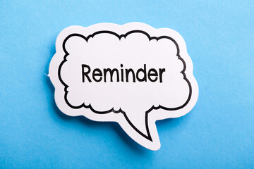 Reminder Speech Bubble Isolated On Blue Background
